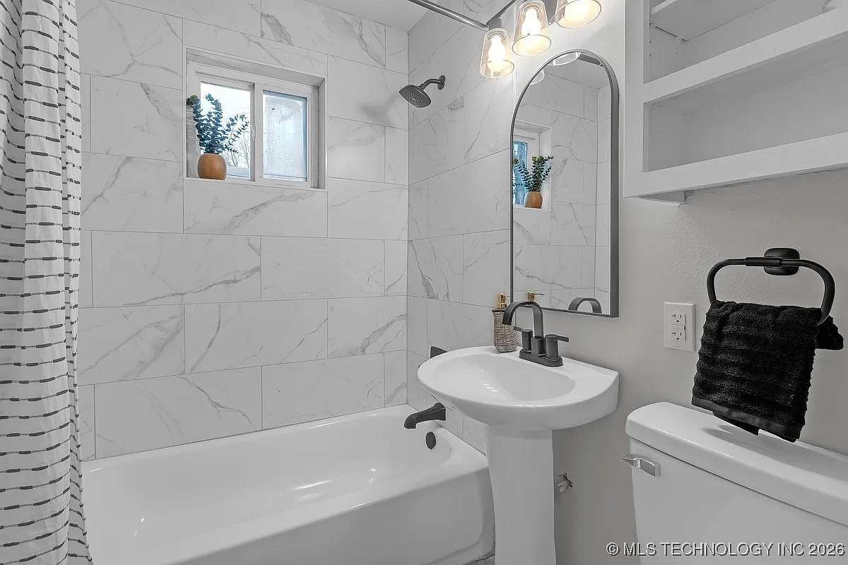 Bathroom remodel with large format tile tub surround