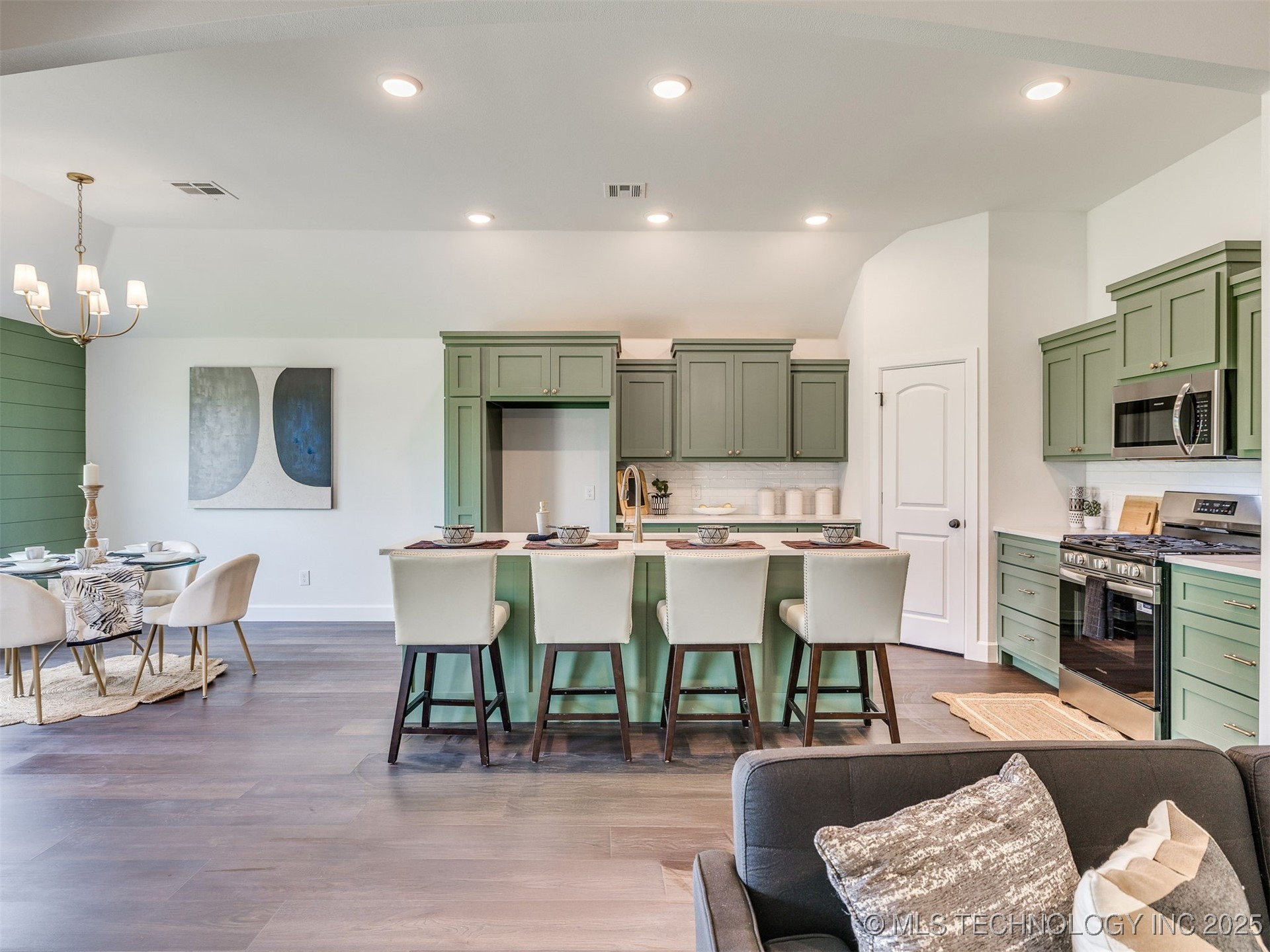 Green cabinet kitchen remodel with large island
